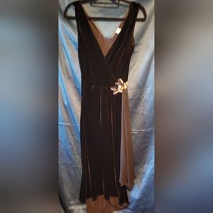 Vintage black velvet cocktail dress with hip embellishment.